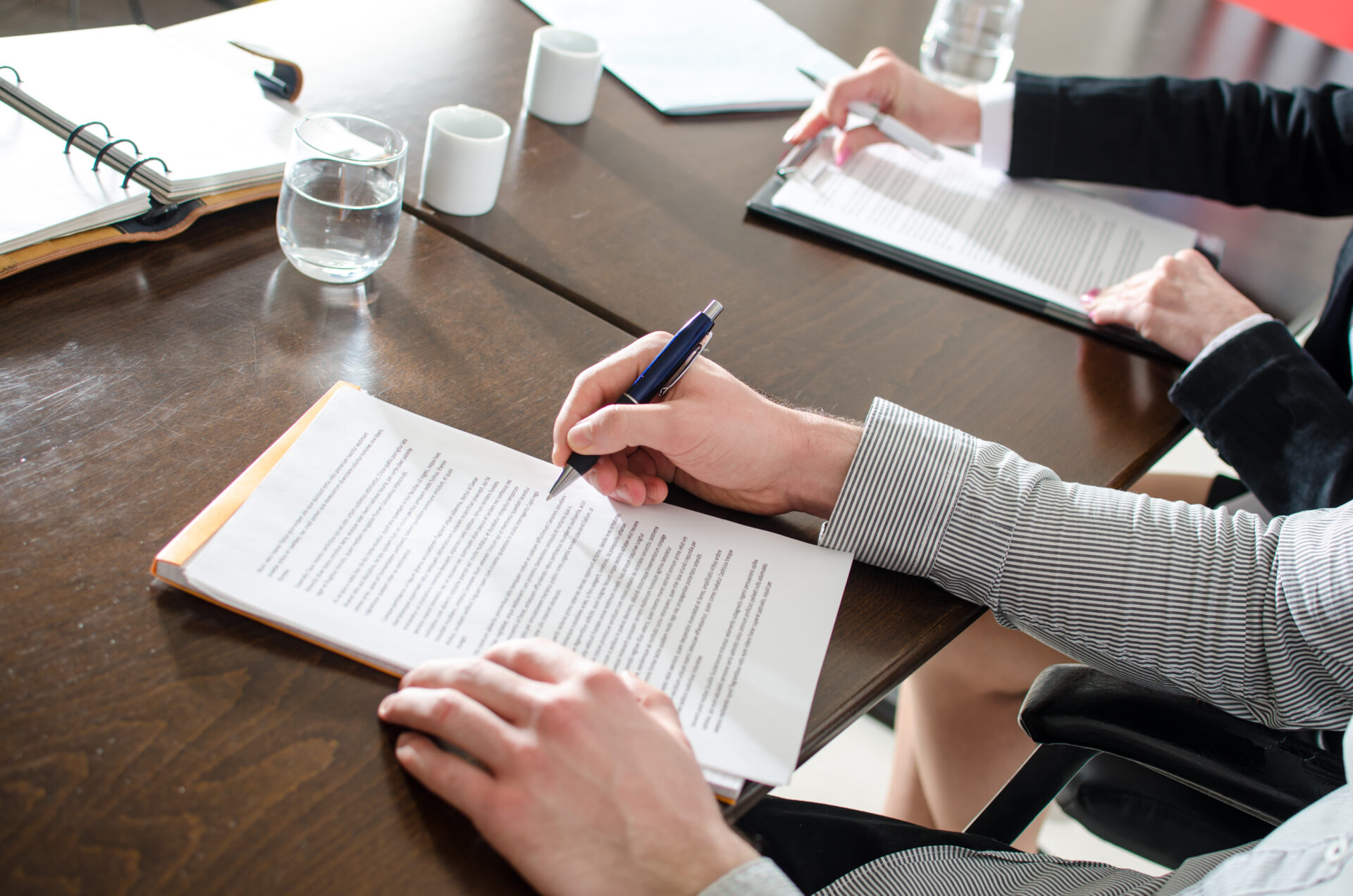 Business people taking notes during a training